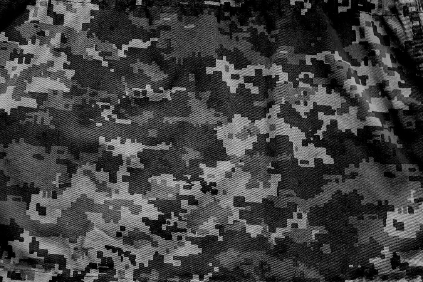 Military camouflage fabric, background texture. Digital camouflage pattern. Forest camouflage texture.